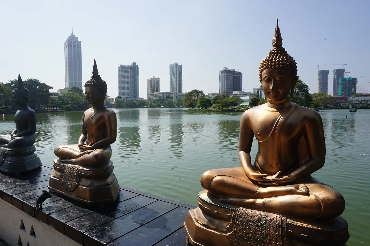 Golden Buddha statues on the Seema Malaka temple platform on Beira Lake, Colombo