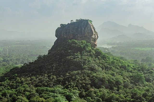 Sigiriya Lion Rock rising from dense jungle